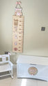 Personalised white wooden children’s rocking chair with decorative name lettering and bow