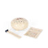 A ceramic steel pan harmonica set on a white background, including a cream-colored round harmonica decorated with floral patterns, wooden mallets with black rubber tips, and a small instruction card.